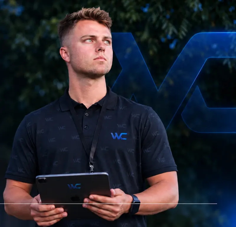 A Wood Consulting rep holding a tablet